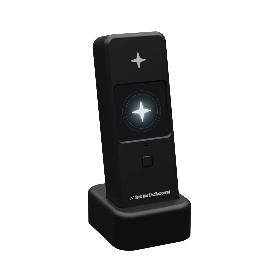 Orion, a small black device with a glowing star on its screen, standing on its desk stand